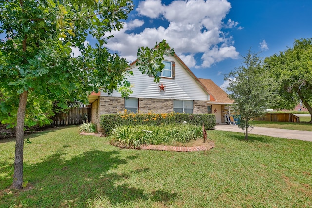 view of side of property featuring a yard