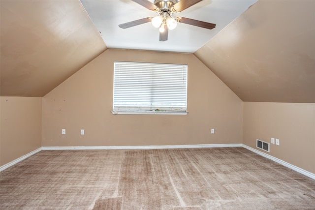 bonus room featuring ceiling fan, vaulted ceiling, and light colored carpet