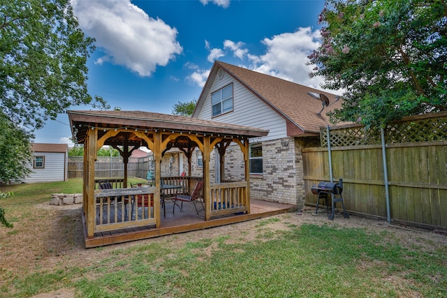 view of yard with a wooden deck and a gazebo