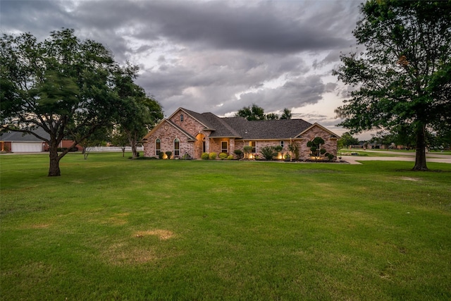 french country home with a front lawn