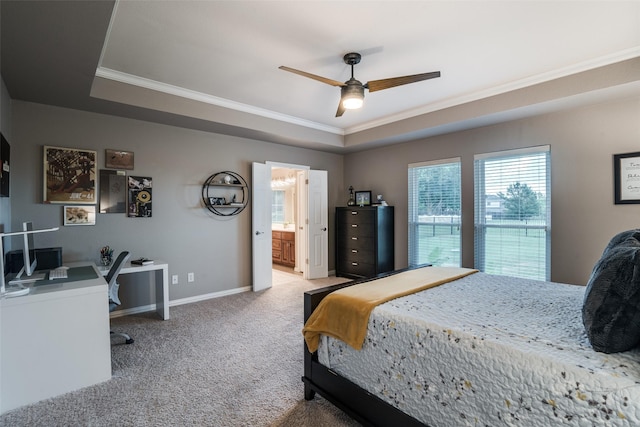 bedroom featuring carpet, baseboards, a raised ceiling, and ornamental molding