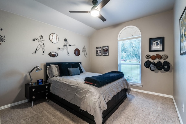 bedroom with lofted ceiling, carpet, baseboards, and a ceiling fan