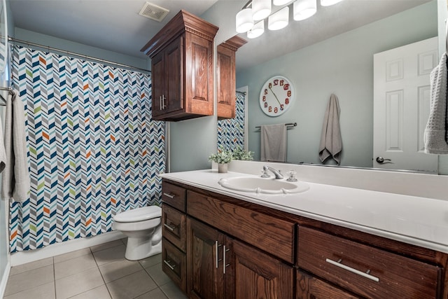 full bathroom featuring visible vents, a shower with shower curtain, toilet, tile patterned floors, and vanity