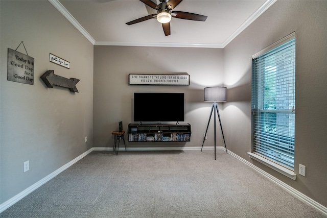 carpeted living room featuring ceiling fan, ornamental molding, and baseboards