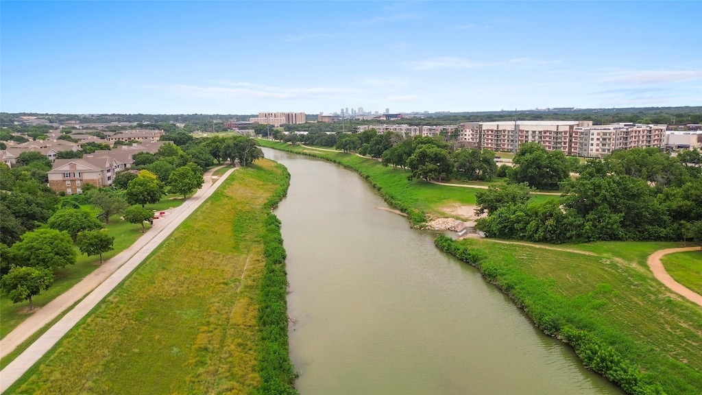 birds eye view of property featuring a water view and a view of city