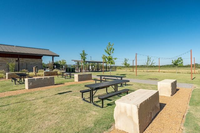 view of home's community with a yard