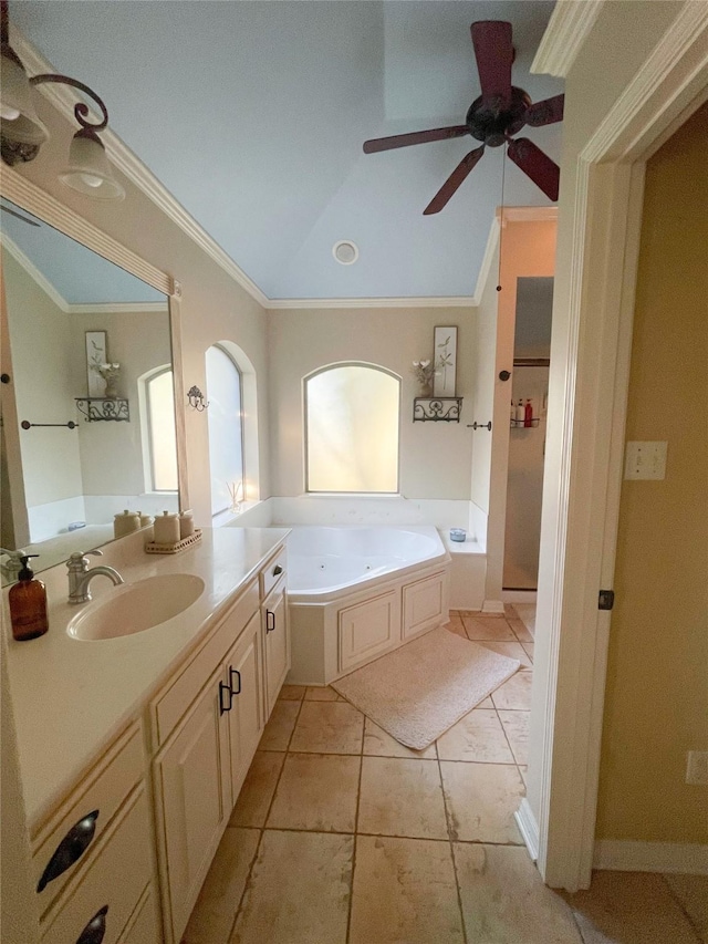 full bathroom featuring lofted ceiling, ceiling fan, a jetted tub, crown molding, and vanity