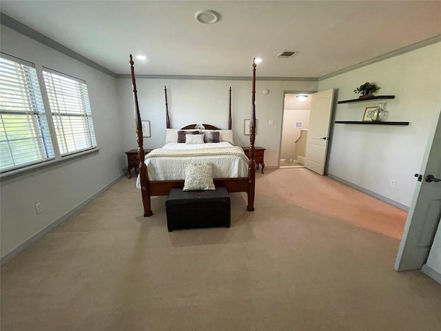 bedroom with light colored carpet, visible vents, crown molding, and baseboards