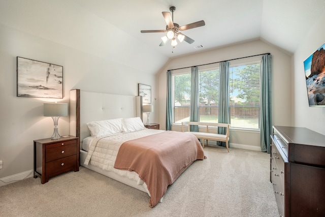 carpeted bedroom featuring multiple windows, ceiling fan, and lofted ceiling