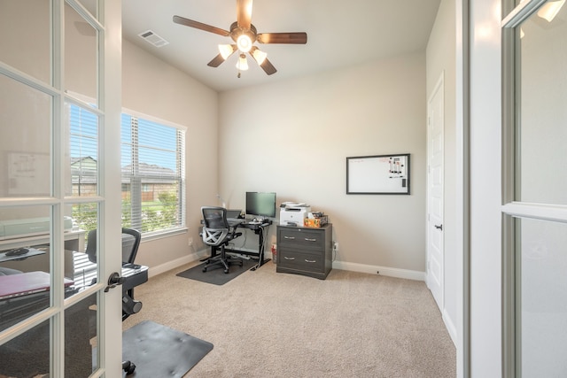 office area featuring light colored carpet and ceiling fan