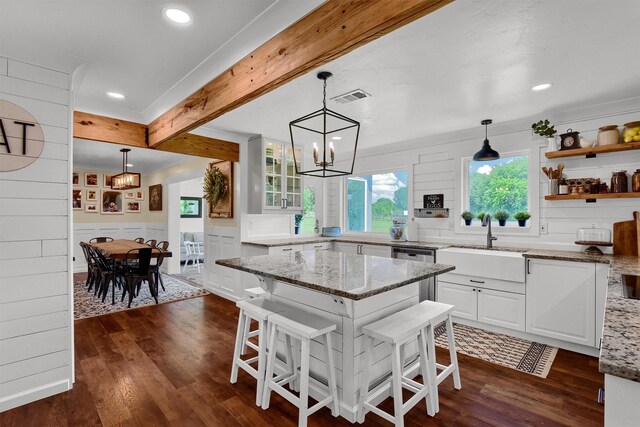 kitchen featuring an inviting chandelier, dark hardwood / wood-style floors, white cabinetry, beamed ceiling, and sink