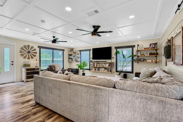 living area featuring recessed lighting, visible vents, ceiling fan, wood finished floors, and coffered ceiling