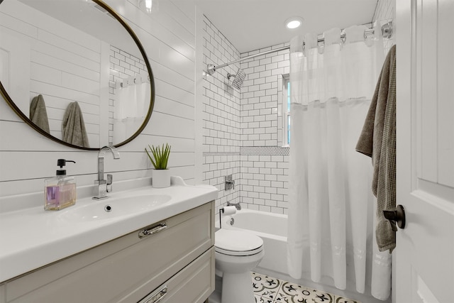 full bathroom featuring vanity, toilet, tile floors, and shower / tub combo