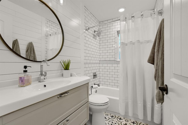 full bathroom with toilet, shower / bath combo with shower curtain, and vanity