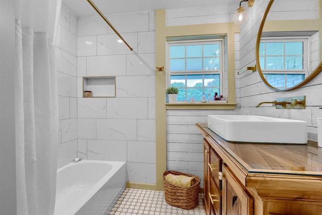 bathroom with tile floors, shower / tub combo, and vanity