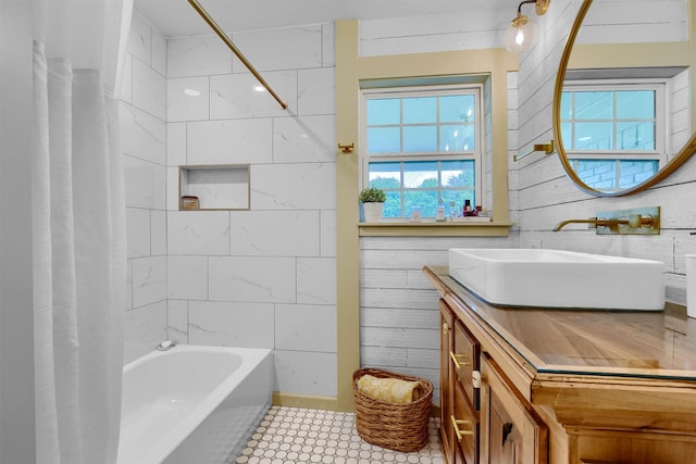 full bathroom featuring shower / bath combo with shower curtain and vanity