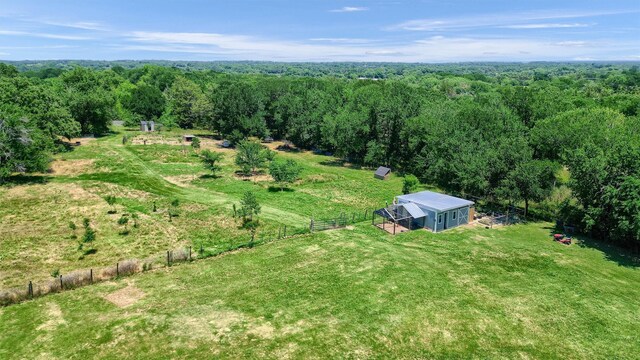 birds eye view of property with a rural view