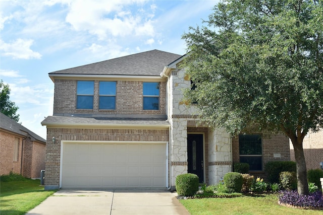 view of front of house with a front lawn and a garage