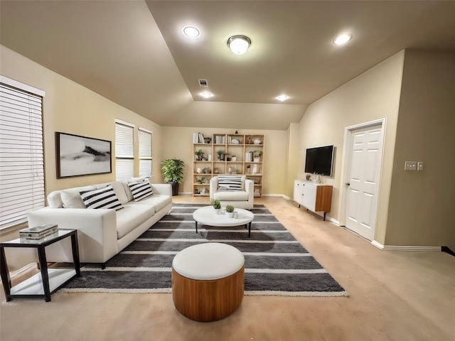 carpeted living room featuring vaulted ceiling