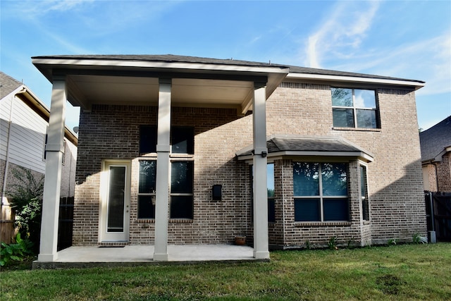 view of side of home featuring a yard and a garage