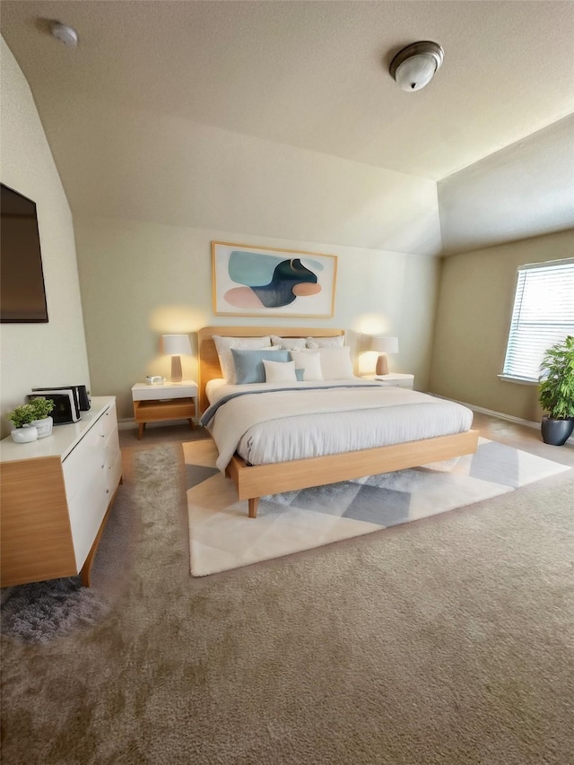 carpeted bedroom with vaulted ceiling