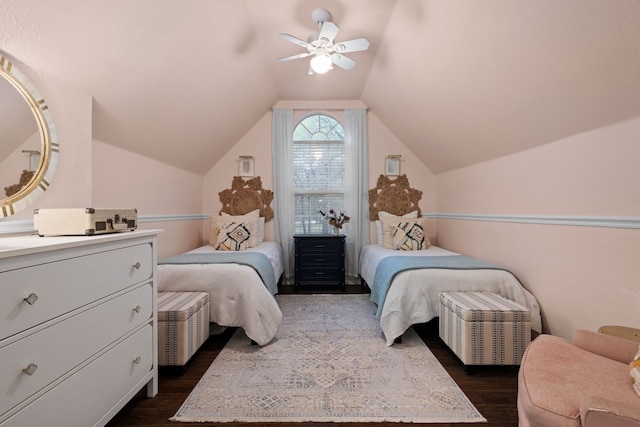 bedroom with dark wood-style floors, ceiling fan, and vaulted ceiling