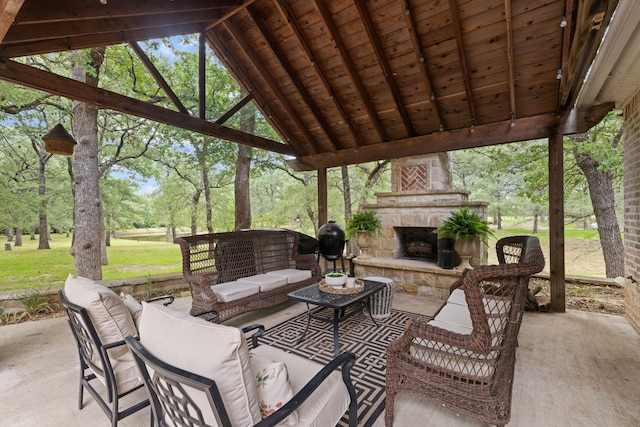 view of patio featuring an outdoor living space with a fireplace