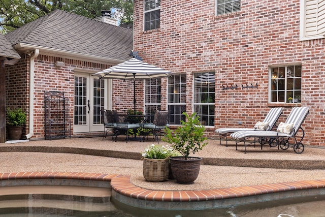 view of patio featuring french doors