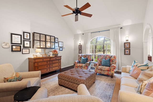 living room with high vaulted ceiling, wood finished floors, a ceiling fan, and baseboards