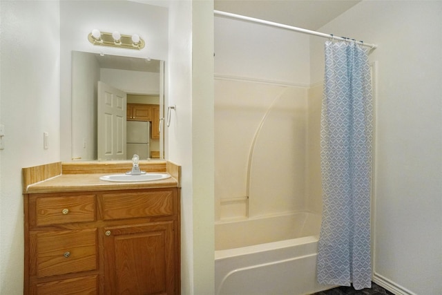 bathroom featuring vanity and shower / bathtub combination with curtain