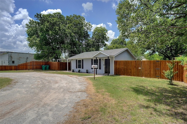 ranch-style house with a front lawn