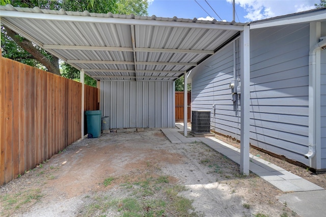 view of patio featuring central AC and a carport