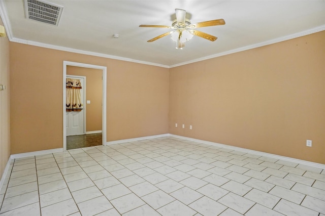 tiled empty room with ceiling fan and ornamental molding