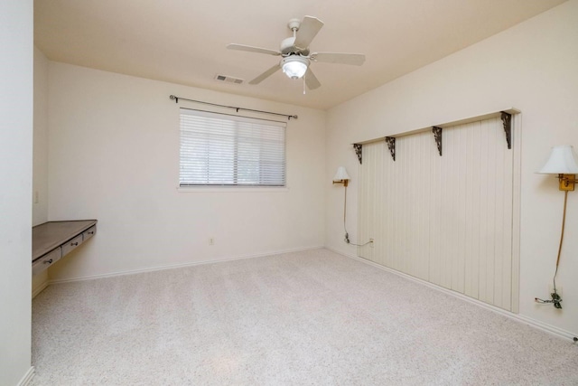 carpeted empty room with ceiling fan