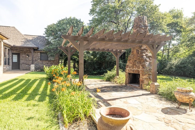 exterior space with an outdoor stone fireplace, a pergola, and a patio area