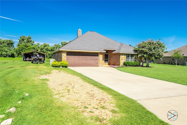 view of front of home featuring a front yard, a garage, and a carport