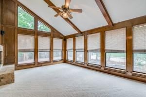 unfurnished sunroom with ceiling fan and lofted ceiling with beams