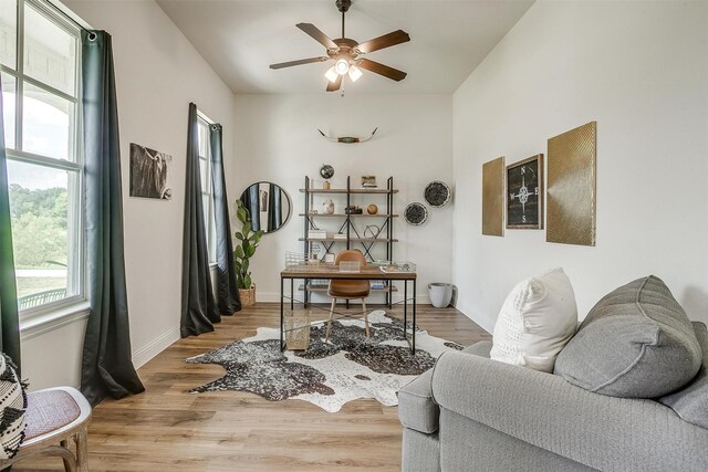 interior space with ceiling fan and hardwood / wood-style floors