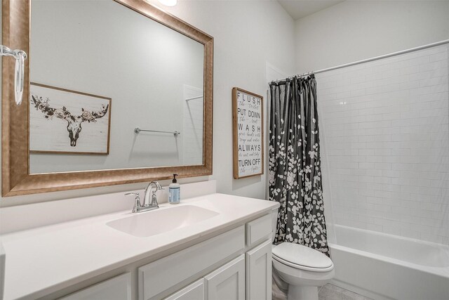 full bathroom with toilet, vanity, and shower / tub combo with curtain