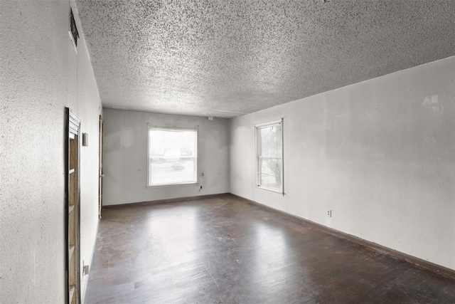 spare room featuring a textured ceiling