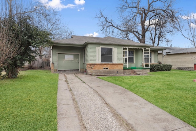 single story home featuring a garage and a front lawn