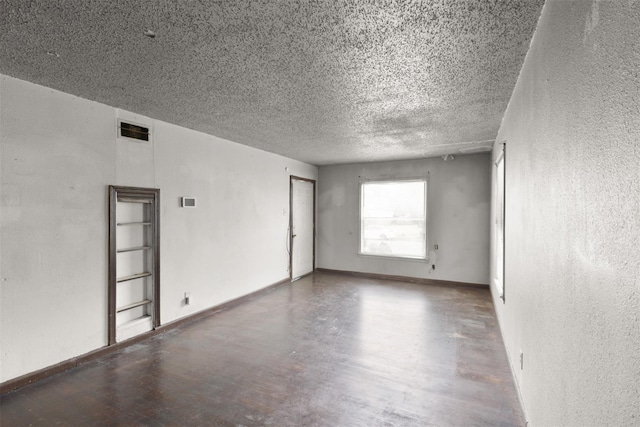 empty room with a textured ceiling