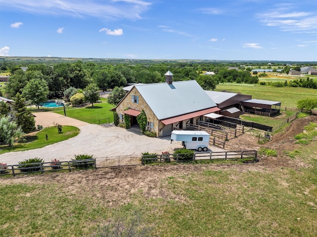 birds eye view of property featuring a rural view