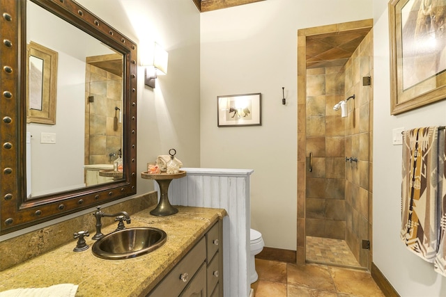 bathroom with an enclosed shower, vanity, and toilet