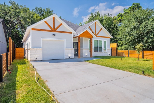 view of front of house with a front lawn and a garage