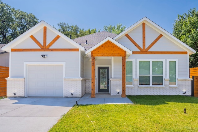 view of front facade with a front yard and a garage