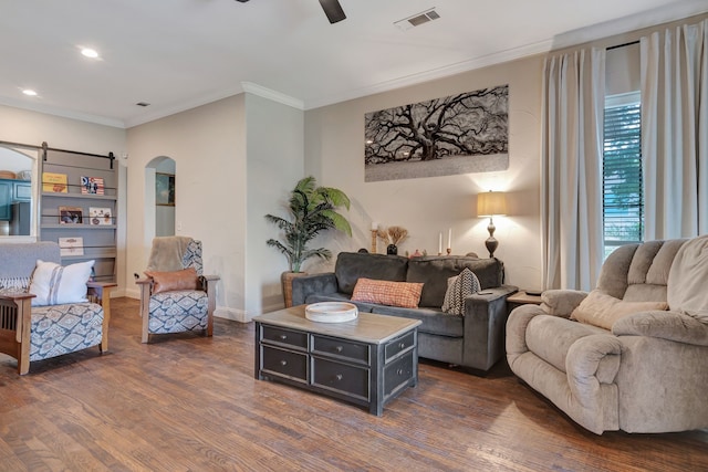 living room featuring dark hardwood / wood-style flooring, ceiling fan, and ornamental molding