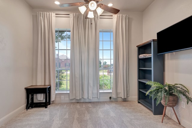 interior space featuring ceiling fan