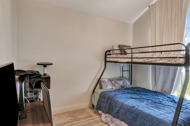 bedroom with lofted ceiling