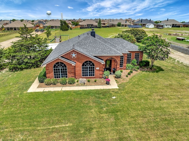 ranch-style house with a front yard